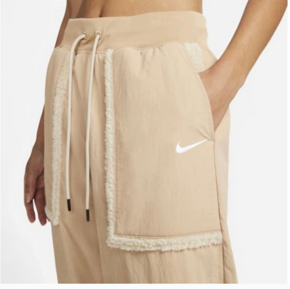 NIKE Women's Sportswear Essential Woven High-Waisted Curve Pants. Tan/cream. XS - Picture 3 of 14